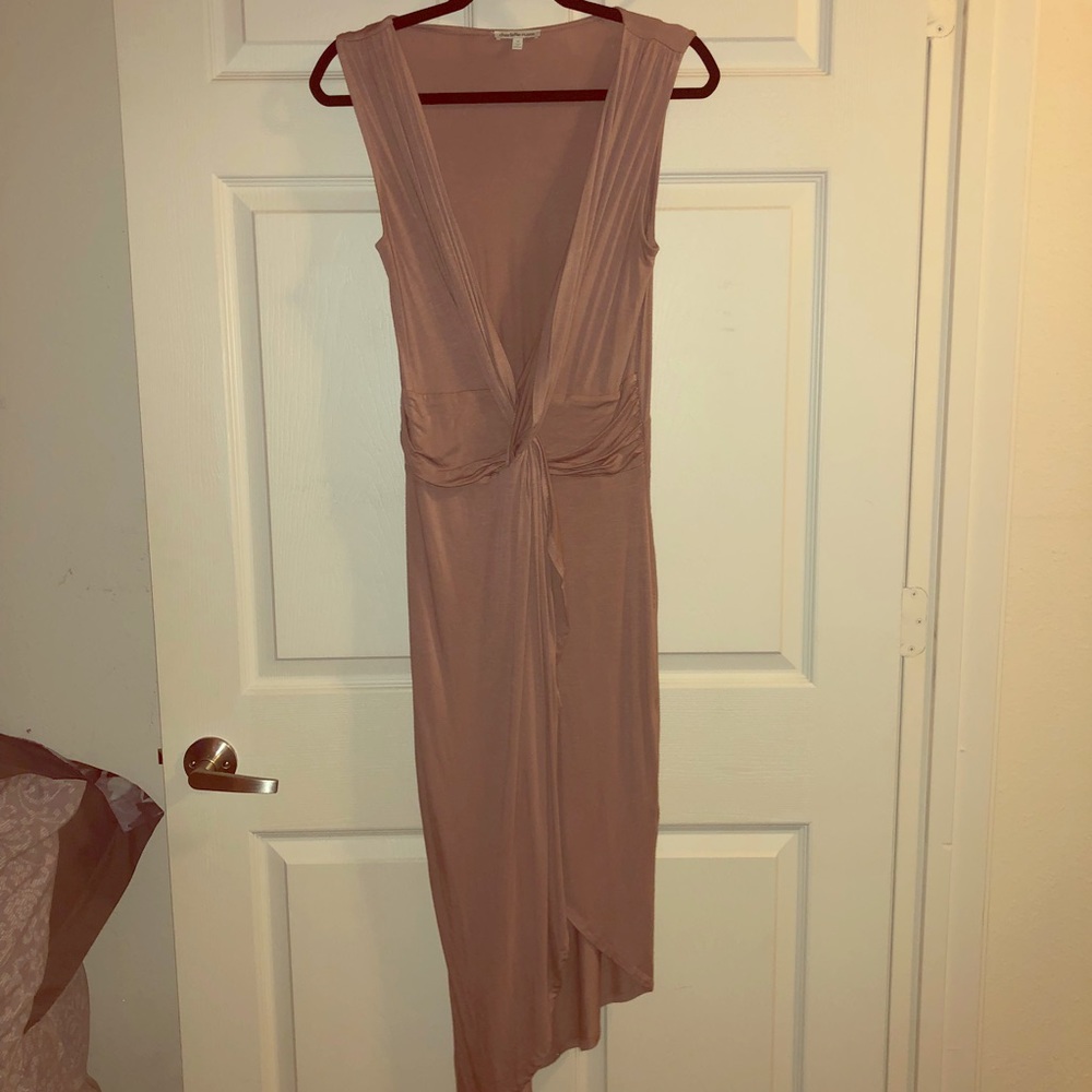 A knee-length taupe sleeveless dress